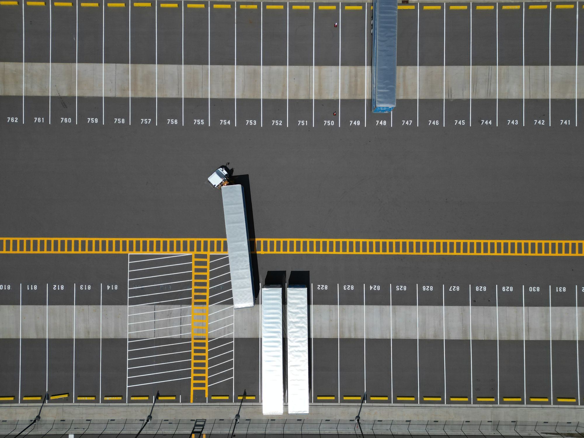 Aerial view of trailers backed into a distribution dock